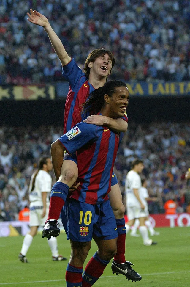 A young Lionel Messi celebrating on Ronaldinho's back