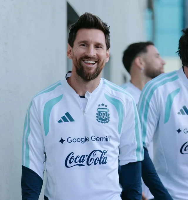 Lionel Messi smiling in an Argentina training shirt