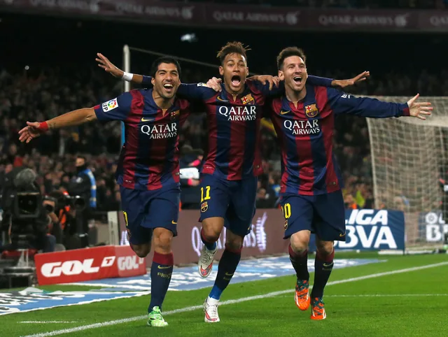 Luis Suárez, Neymar, and Lionel Messi celebrating together